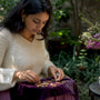 Woman exploring jewelry for self-expression