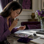 Buyer examining loose gemstones in home setting