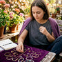 Woman inspecting affordable jewelry at home