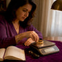 Woman weighing gold jewelry on scale