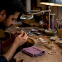 Jewelry finishes comparison on artisan workbench