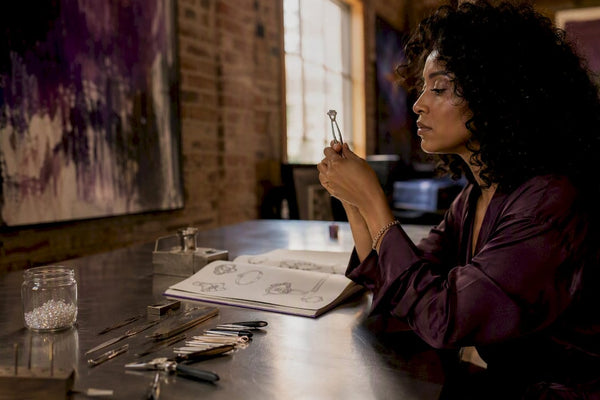 Jewelry designer examining ethical moissanite ring