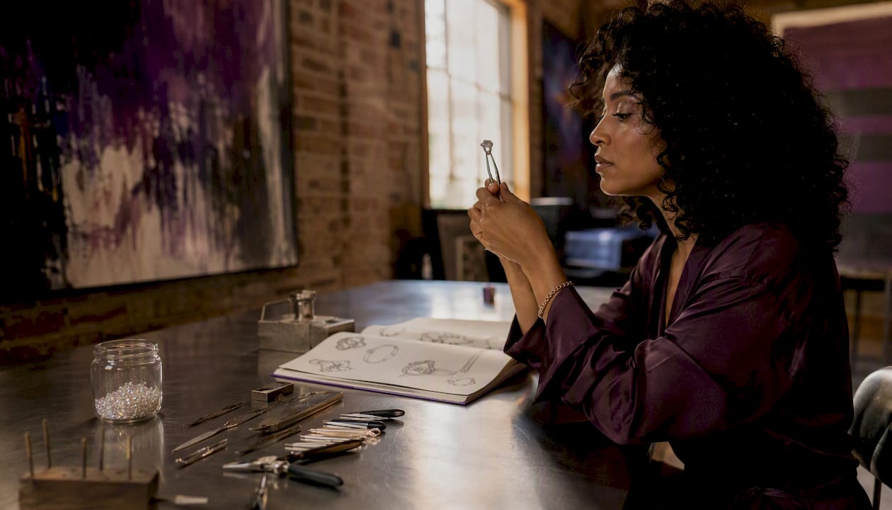 Jewelry designer examining ethical moissanite ring