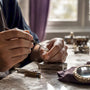 Artisan hands setting sustainable jewel