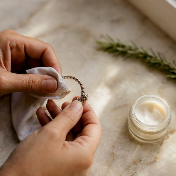 Hand polishing tarnish resistant jewelry close-up