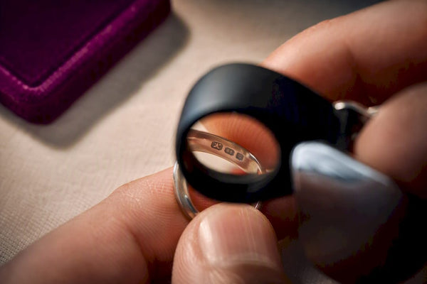 Loupe inspecting a jewelry metal stamp