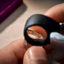 Loupe inspecting a jewelry metal stamp