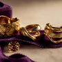 Cropped sculptural gold band details
