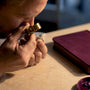 Gemologist inspecting jewelry for appraisal