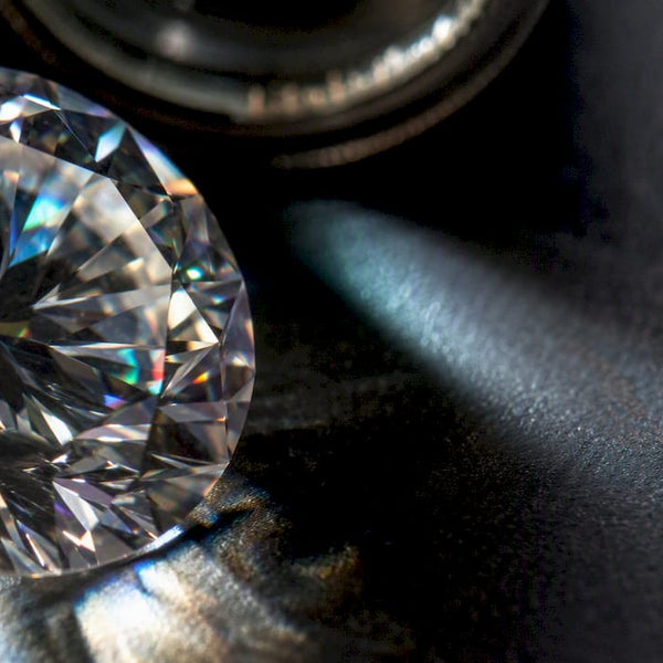 Faceted moissanite showing colorful light flashes