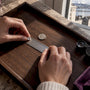 Stone checked beside ruler and coin