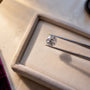 Loose moissanite examined for subtle color