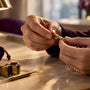 Jeweler inspecting a jewelry clasp