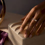 East-west elongated ring worn on hand