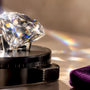 Faceted moissanite under optical testing light