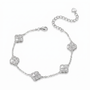 A silver chain bracelet featuring five pavé-set clear stones arranged in a floral clover pattern, with a lobster clasp and an adjustable extender chain with a heart-shaped tag, shown on a plain white background.
