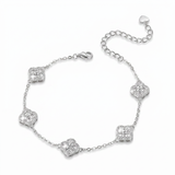 A silver chain bracelet featuring five pavé-set clear stones arranged in a floral clover pattern, with a lobster clasp and an adjustable extender chain with a heart-shaped tag, shown on a plain white background.