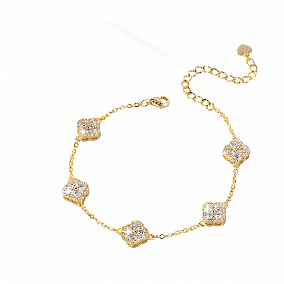 A gold chain bracelet featuring five alternating clover-shaped and square motifs paved with clear stones, displayed on a clean white background.