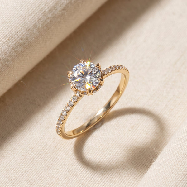 Jewelry $200 to $300 - Zug gold moissanite pave solitaire ring on cream linen